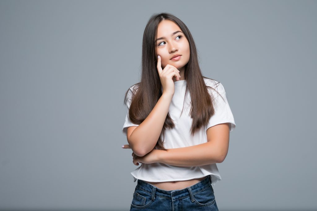 thinking woman look copy space isolated grey background with finger face asian beauty 1024x683 1